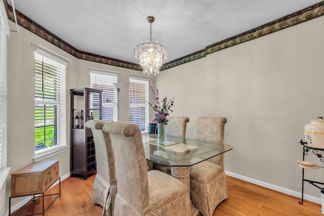 3360 Knob Oaks Dr, Huntsville, TX 77340 - dining space featuring wood finished floors and a chandelier