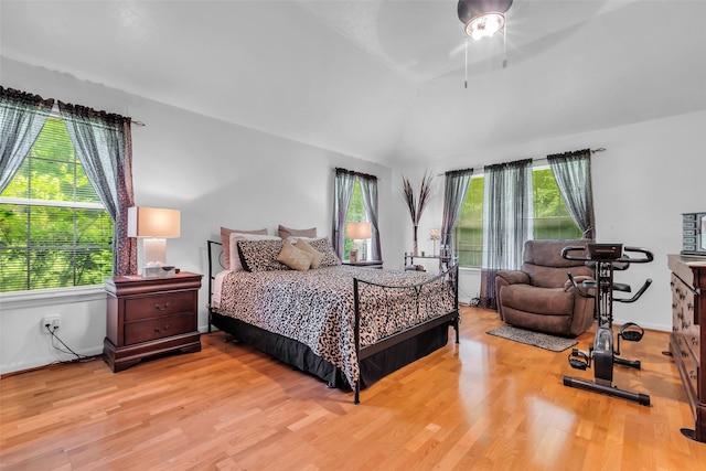 3360 Knob Oaks Dr, Huntsville, TX 77340 - bedroom featuring wood finished floors, lofted ceiling, and ceiling fan