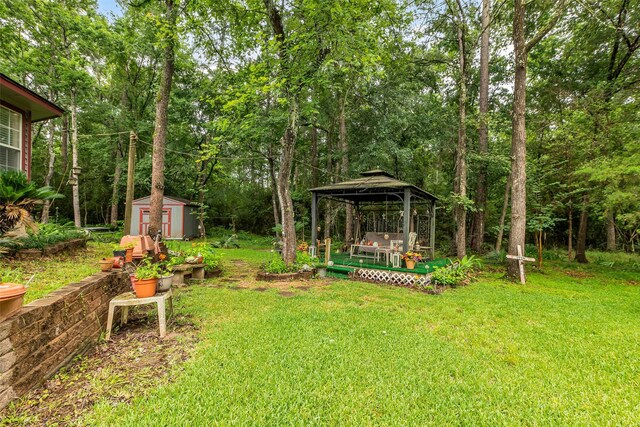 3360 Knob Oaks Dr, Huntsville, TX 77340 - view of green lawn featuring a gazebo and a shed