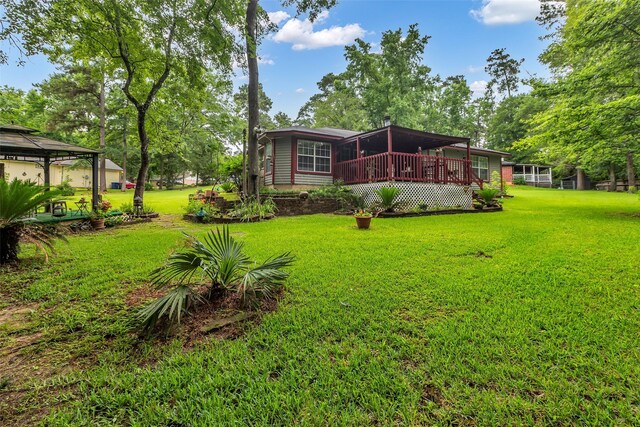 3360 Knob Oaks Dr, Huntsville, TX 77340 - view of grassy yard with a wooden deck and a gazebo