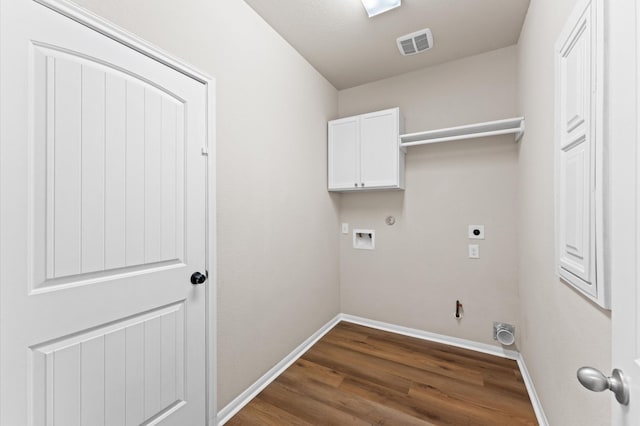 9415 Vista Falls Ct, Richmond, TX 77469 - laundry room with electric dryer hookup, hookup for a gas dryer, cabinet space, hookup for a washing machine, and dark wood-style flooring