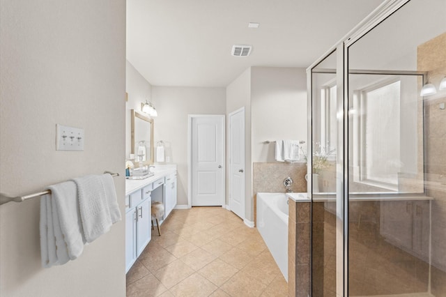 9415 Vista Falls Ct, Richmond, TX 77469 - full bath with double vanity, a garden tub, a shower stall, and tile patterned floors