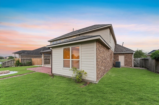 9415 Vista Falls Ct, Richmond, TX 77469 - rear view of property with brick siding, a fenced backyard, a patio area, and roof with shingles