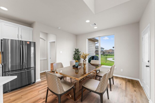 9415 Vista Falls Ct, Richmond, TX 77469 - dining space with light wood-style floors and recessed lighting