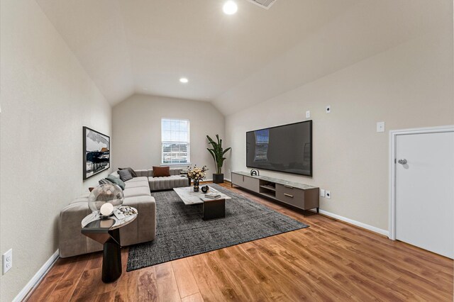 9415 Vista Falls Ct, Richmond, TX 77469 - living area with lofted ceiling, wood finished floors, and recessed lighting