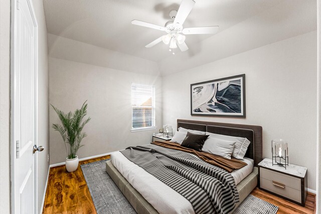 9415 Vista Falls Ct, Richmond, TX 77469 - bedroom with wood finished floors and a ceiling fan
