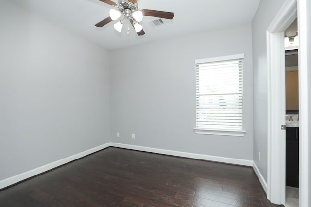 5120 Larkin St, Houston, TX 77007 - unfurnished bedroom with dark wood-style floors and a ceiling fan