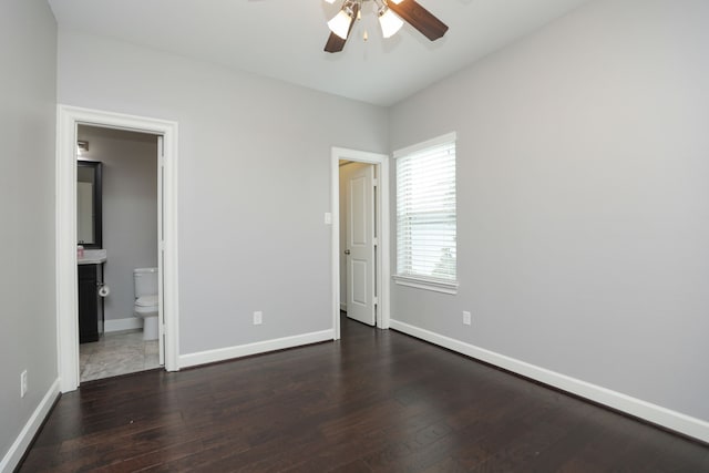 5120 Larkin St, Houston, TX 77007 - unfurnished bedroom with dark wood-style flooring, connected bathroom, and ceiling fan