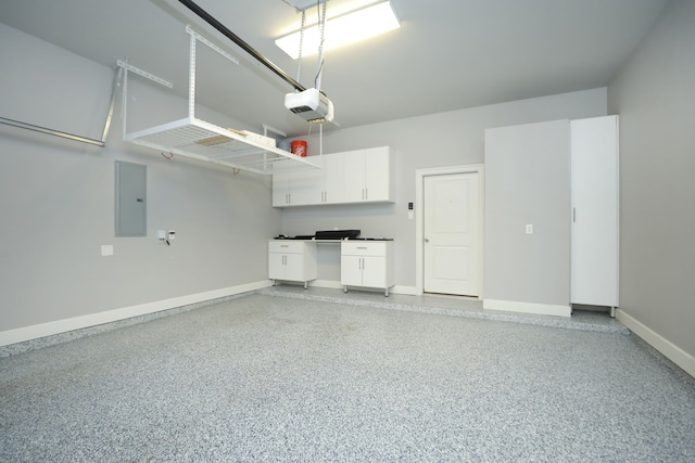 5120 Larkin St, Houston, TX 77007 - garage featuring electric panel and a garage door opener