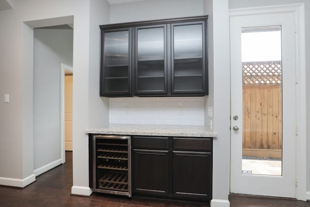 5120 Larkin St, Houston, TX 77007 - bar with beverage cooler, dark wood-style floors, and tasteful backsplash