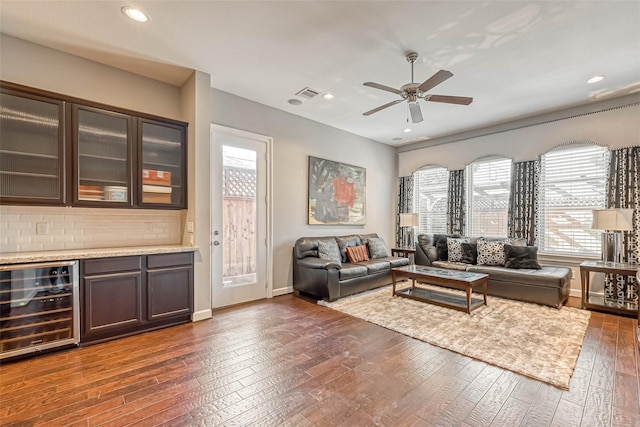 5120 Larkin St, Houston, TX 77007 - living area featuring wine cooler, healthy amount of natural light, dark wood finished floors, a ceiling fan, and recessed lighting