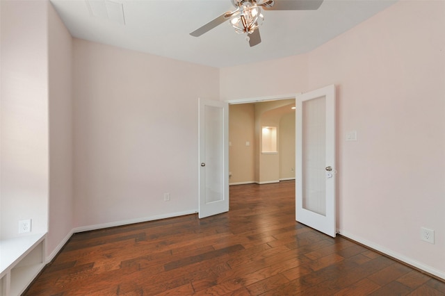 24030 Tirso River Ct, Katy, TX 77493 - empty room featuring arched walkways, ceiling fan, hardwood / wood-style floors, and french doors