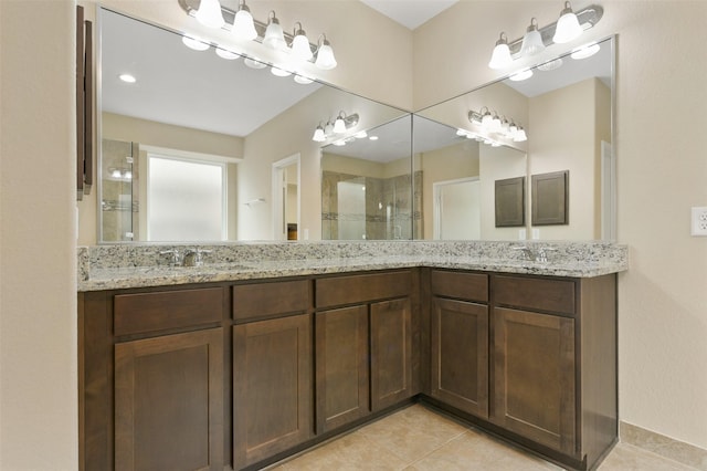 24030 Tirso River Ct, Katy, TX 77493 - bathroom with double vanity, a shower stall, and tile patterned floors