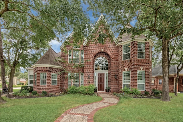 16022 Conners Ace Dr, Spring, TX 77379 - view of front of property with brick siding, a front yard, and roof with shingles