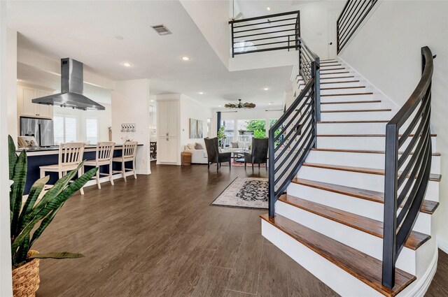 16022 Conners Ace Dr, Spring, TX 77379 - stairs featuring wood finished floors and recessed lighting