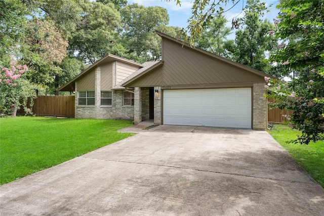 2403 Mustang Dr, Conroe, TX 77384 - mid-century home featuring brick siding, driveway, and an attached garage