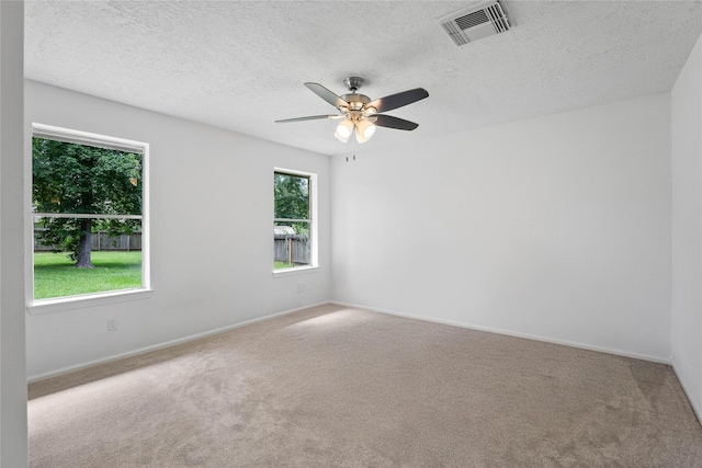 2403 Mustang Dr, Conroe, TX 77384 - carpeted empty room featuring a textured ceiling and ceiling fan