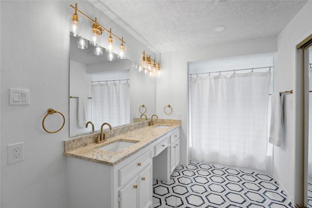 2403 Mustang Dr, Conroe, TX 77384 - full bathroom with a textured ceiling, double vanity, and shower / bath combination with curtain