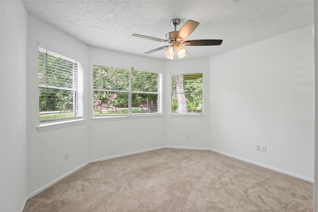 2403 Mustang Dr, Conroe, TX 77384 - spare room with carpet floors, ceiling fan, and a textured ceiling