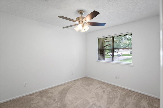 2403 Mustang Dr, Conroe, TX 77384 - unfurnished room featuring carpet flooring, a textured ceiling, and ceiling fan