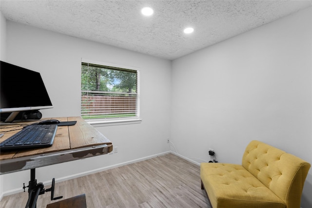 2403 Mustang Dr, Conroe, TX 77384 - office area with wood finished floors, recessed lighting, and a textured ceiling