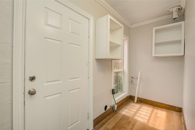 911 Wooding St, Houston, TX 77011 - washroom featuring light wood finished floors and crown molding