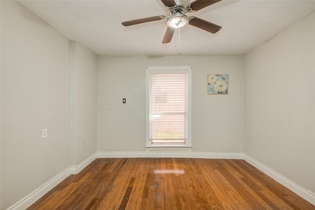 911 Wooding St, Houston, TX 77011 - empty room with wood finished floors and ceiling fan