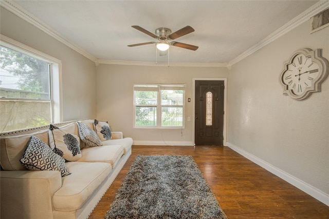 911 Wooding St, Houston, TX 77011 - living room with crown molding, ceiling fan, and wood finished floors