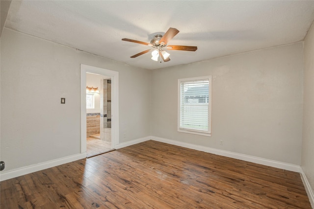 911 Wooding St, Houston, TX 77011 - empty room featuring a ceiling fan and wood finished floors