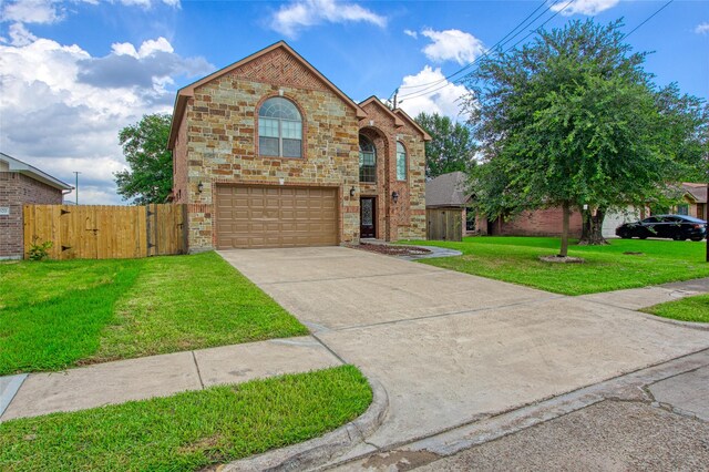 8666 Pearl Point St, Houston, TX 77044 - view of front of property with a garage, concrete driveway, brick siding, and a gate