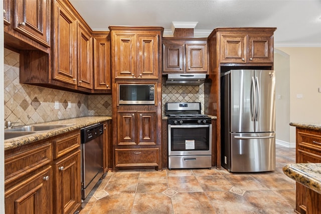 8666 Pearl Point St, Houston, TX 77044 - kitchen featuring stainless steel appliances, under cabinet range hood, crown molding, tasteful backsplash, and light stone counters