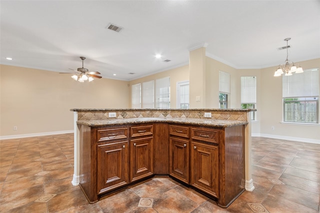 8666 Pearl Point St, Houston, TX 77044 - kitchen with ceiling fan, a chandelier, recessed lighting, decorative light fixtures, and light stone countertops