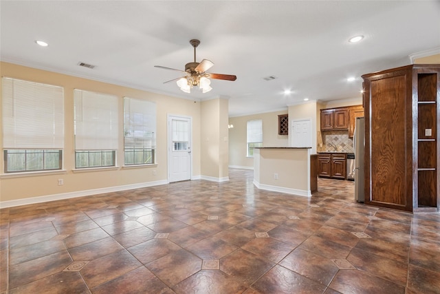 8666 Pearl Point St, Houston, TX 77044 - unfurnished living room with ceiling fan, recessed lighting, crown molding, and dark tile patterned floors
