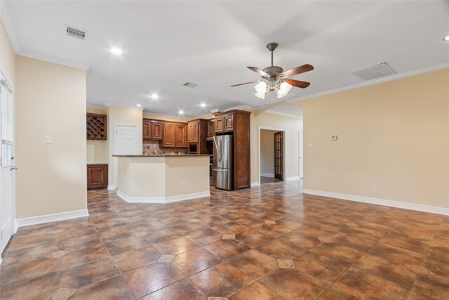 8666 Pearl Point St, Houston, TX 77044 - unfurnished living room with a ceiling fan, arched walkways, crown molding, and recessed lighting