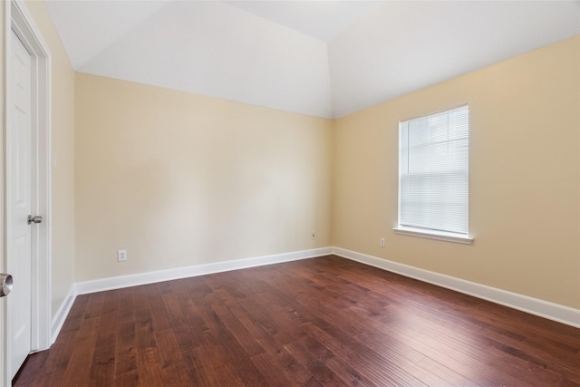 8666 Pearl Point St, Houston, TX 77044 - unfurnished bedroom featuring lofted ceiling and dark wood-style floors