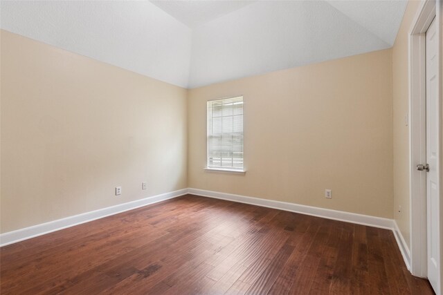 8666 Pearl Point St, Houston, TX 77044 - empty room featuring lofted ceiling and dark wood-style flooring