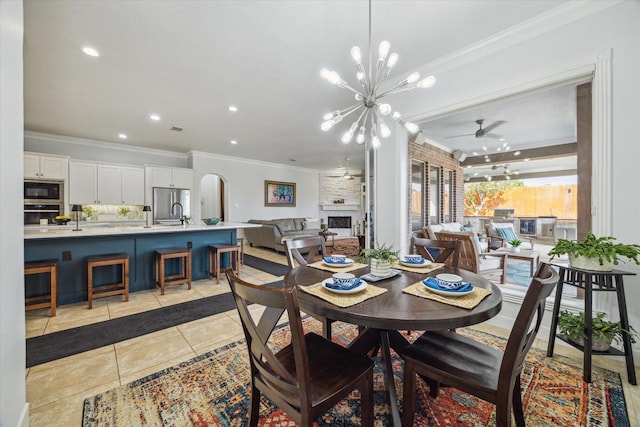 14002 Winding Springs Dr, Cypress, TX 77429 - dining space featuring ornamental molding, light tile patterned floors, a chandelier, ceiling fan, and recessed lighting