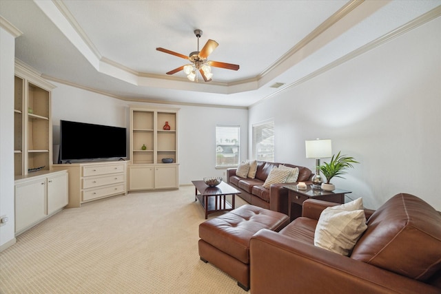14002 Winding Springs Dr, Cypress, TX 77429 - living area with crown molding, a ceiling fan, a raised ceiling, and light colored carpet