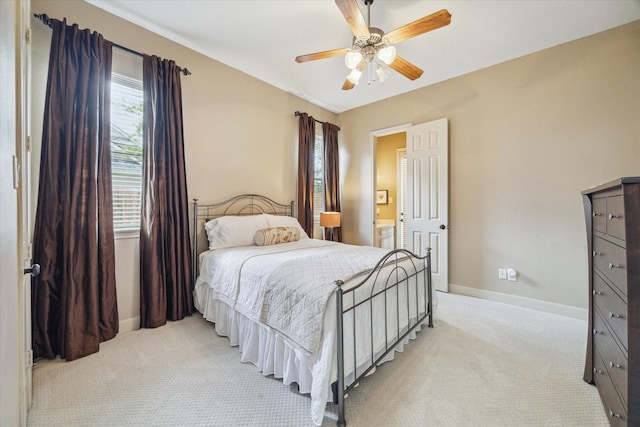 14002 Winding Springs Dr, Cypress, TX 77429 - bedroom with light carpet, ceiling fan, and ensuite bath