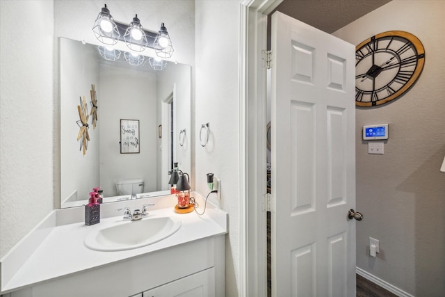18827 Palmetto Hills Dr, New Caney, TX 77357 - half bathroom featuring vanity and toilet
