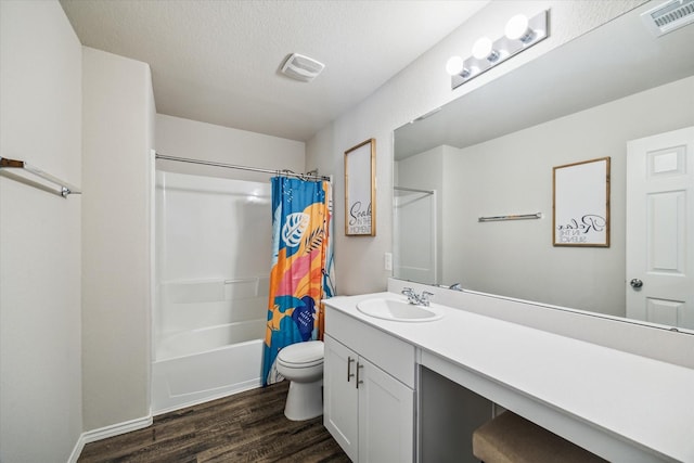 18827 Palmetto Hills Dr, New Caney, TX 77357 - full bath featuring wood finished floors, vanity, shower / tub combo, and a textured ceiling