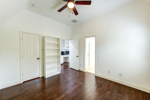 27818 Pinpoint Crossing Dr, Katy, TX 77494 - unfurnished bedroom with dark wood-type flooring, ceiling fan, lofted ceiling, and a walk in closet