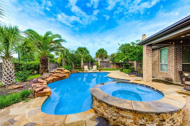 27818 Pinpoint Crossing Dr, Katy, TX 77494 - view of swimming pool featuring a fenced backyard, a pool with connected hot tub, and a patio area