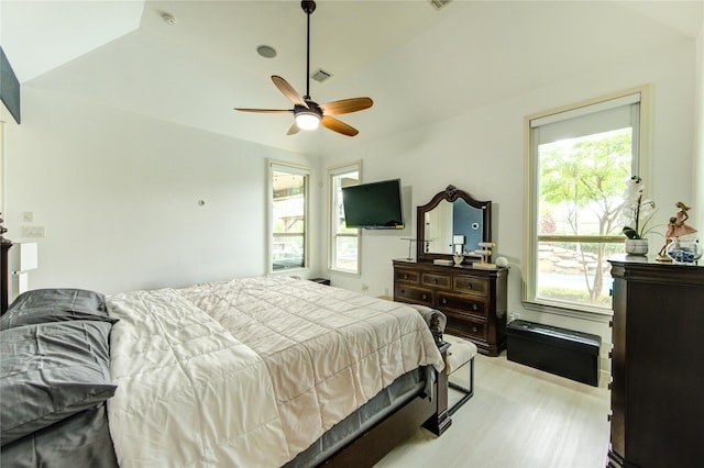27818 Pinpoint Crossing Dr, Katy, TX 77494 - bedroom featuring multiple windows, light wood-style floors, ceiling fan, and vaulted ceiling