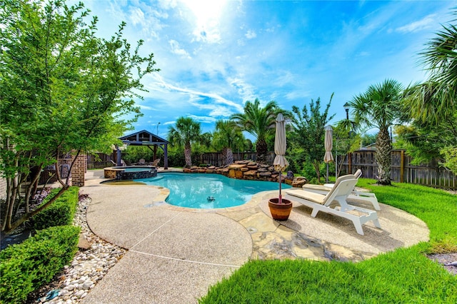 27818 Pinpoint Crossing Dr, Katy, TX 77494 - view of pool featuring a gazebo, a fenced backyard, a patio, and a pool with connected hot tub