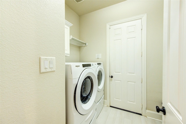 27818 Pinpoint Crossing Dr, Katy, TX 77494 - laundry room with washer and dryer and light wood-style floors
