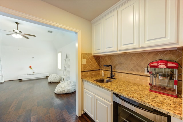 27818 Pinpoint Crossing Dr, Katy, TX 77494 - kitchen featuring wine cooler, light stone countertops, ceiling fan, white cabinetry, and tasteful backsplash