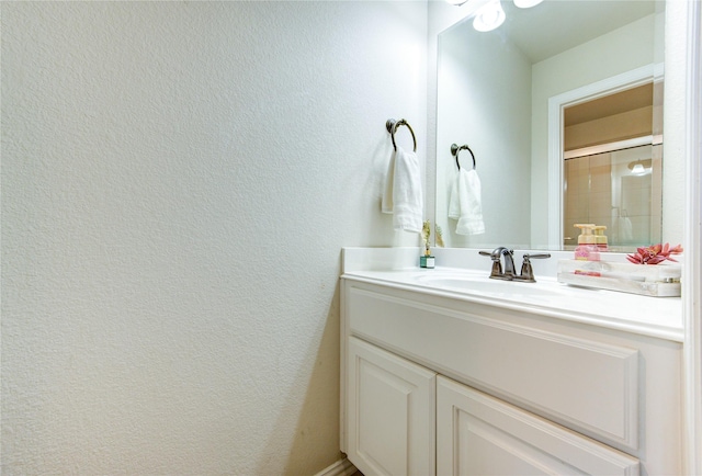 27818 Pinpoint Crossing Dr, Katy, TX 77494 - bathroom with vanity and a textured wall