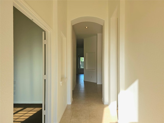 22106 Flashing Ridge Dr, Spring, TX 77389 - hallway featuring arched walkways and light tile patterned flooring