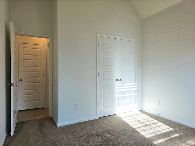 22106 Flashing Ridge Dr, Spring, TX 77389 - unfurnished bedroom featuring carpet flooring, a closet, and vaulted ceiling